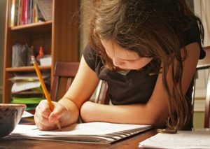 Girl with white skin and brown hair, studying