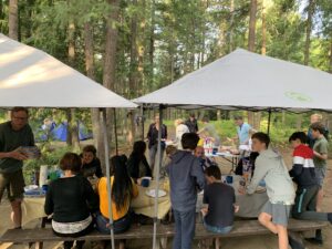 A group of campers getting ready to prepare dinner